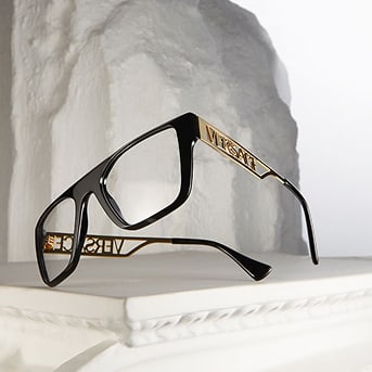 Black luxury eyeglasses with gold accents